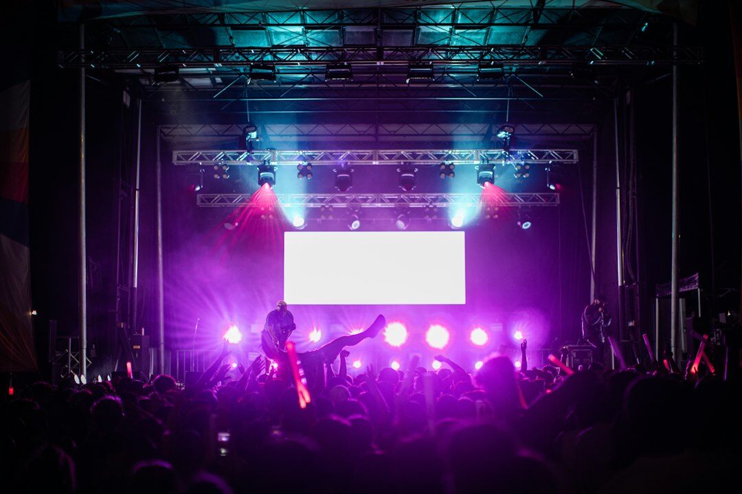 Concert stage with colorful lights and crowd