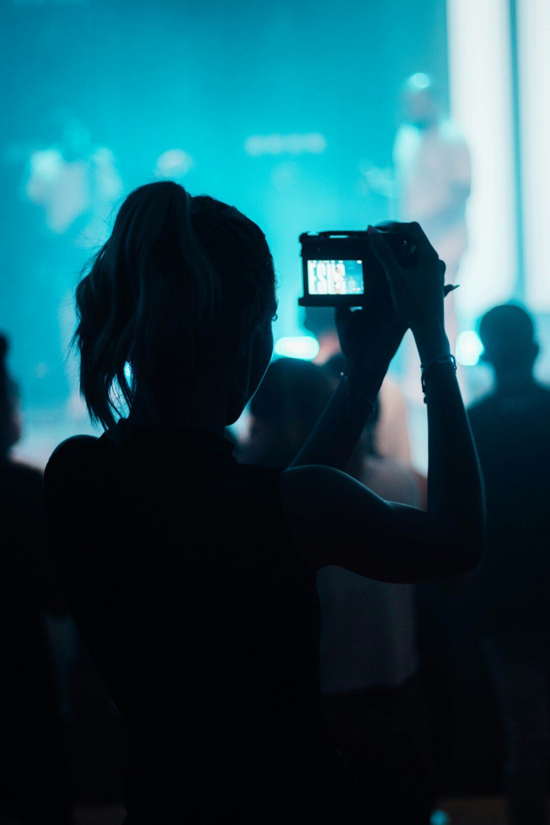 Paparazzi camera lens photographing a celebrity event